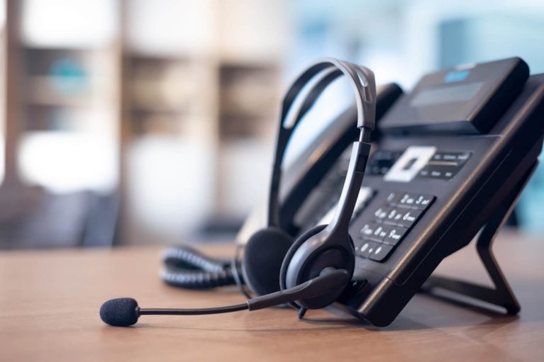 a voip phone in a desk