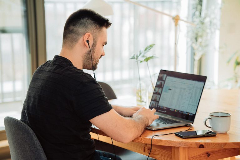 a guy working from home using remote phone systems