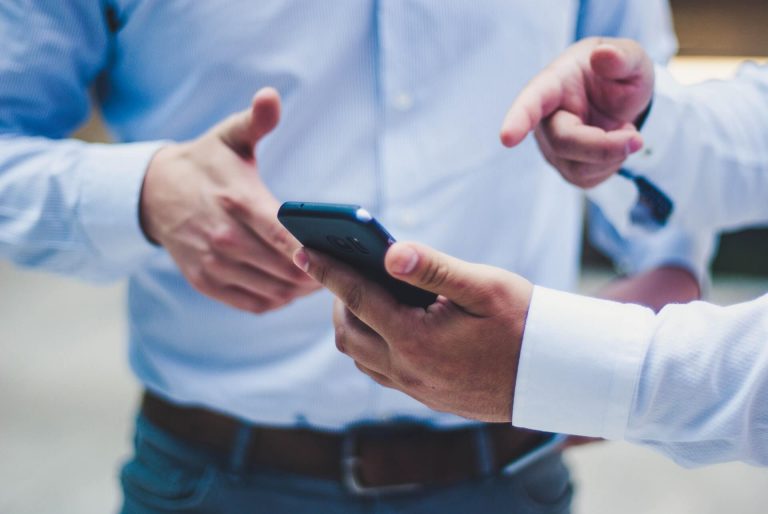 business men discussing a phone system to use for their small business