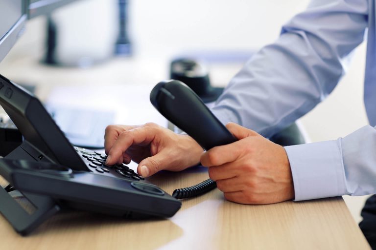 a man setting up a phone system