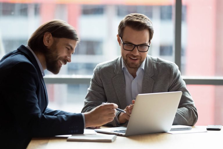 two business men researching enterprise phone system options