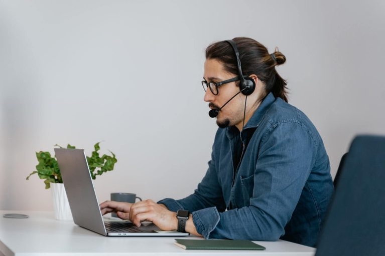 man researching different types of call center