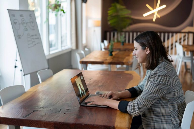 woman in a virtual meeting asking how to share screen
