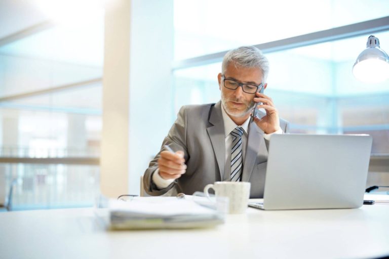 businessman checking how to call us from uk